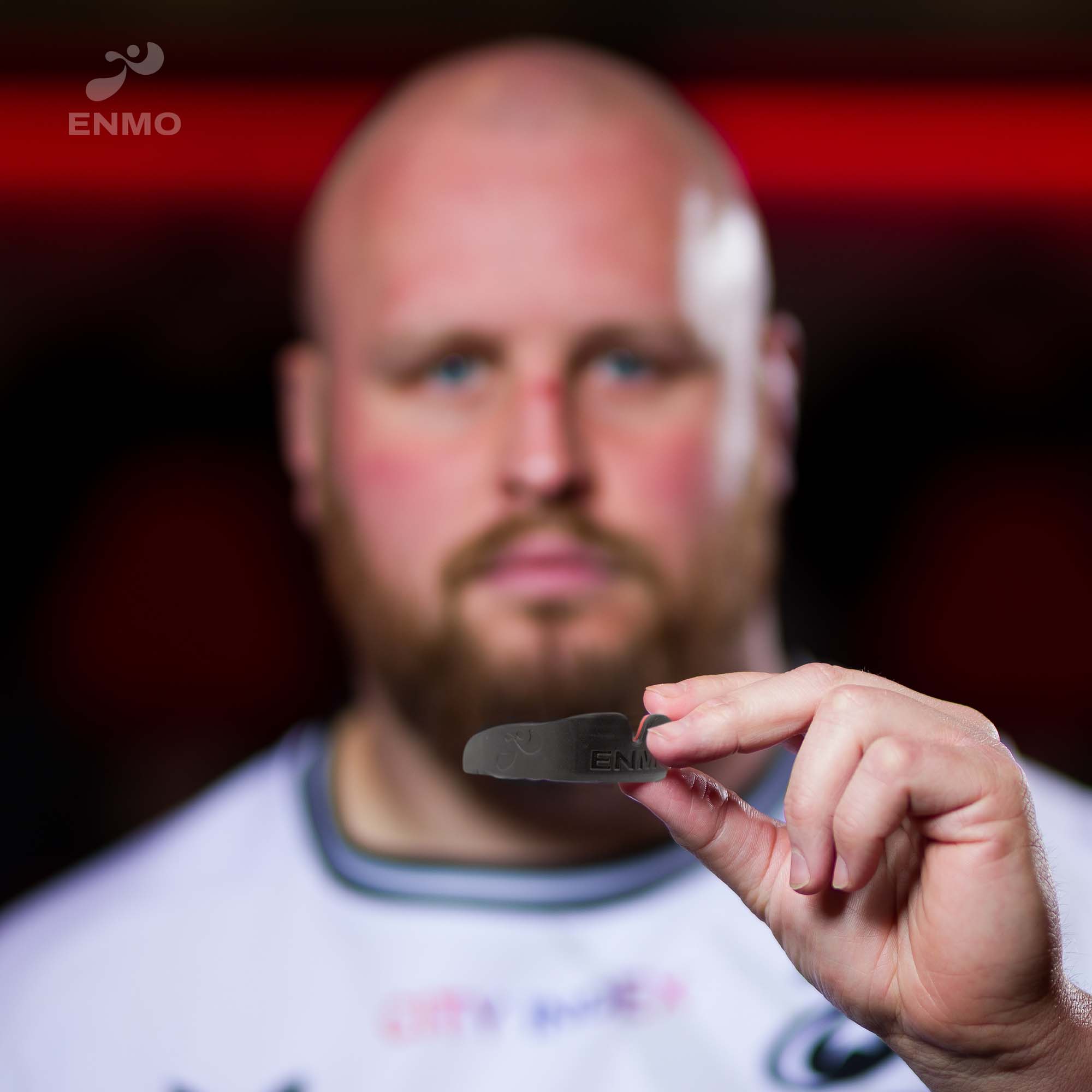 Men Holding Enmo Maxilla Gel Mouthguard - Adult, Black/red