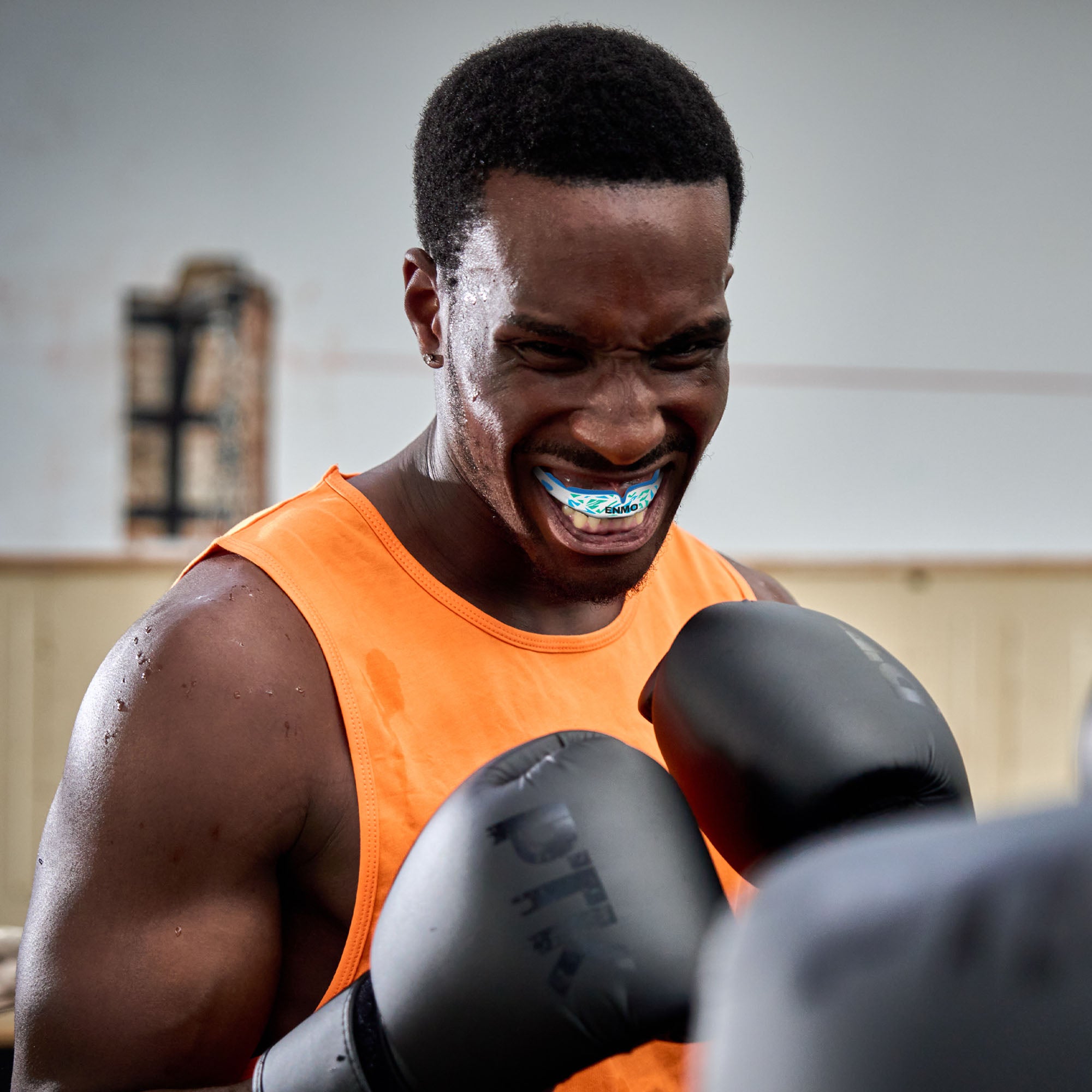 Boxer wearing Enmo Mouthguard in Blue and white.