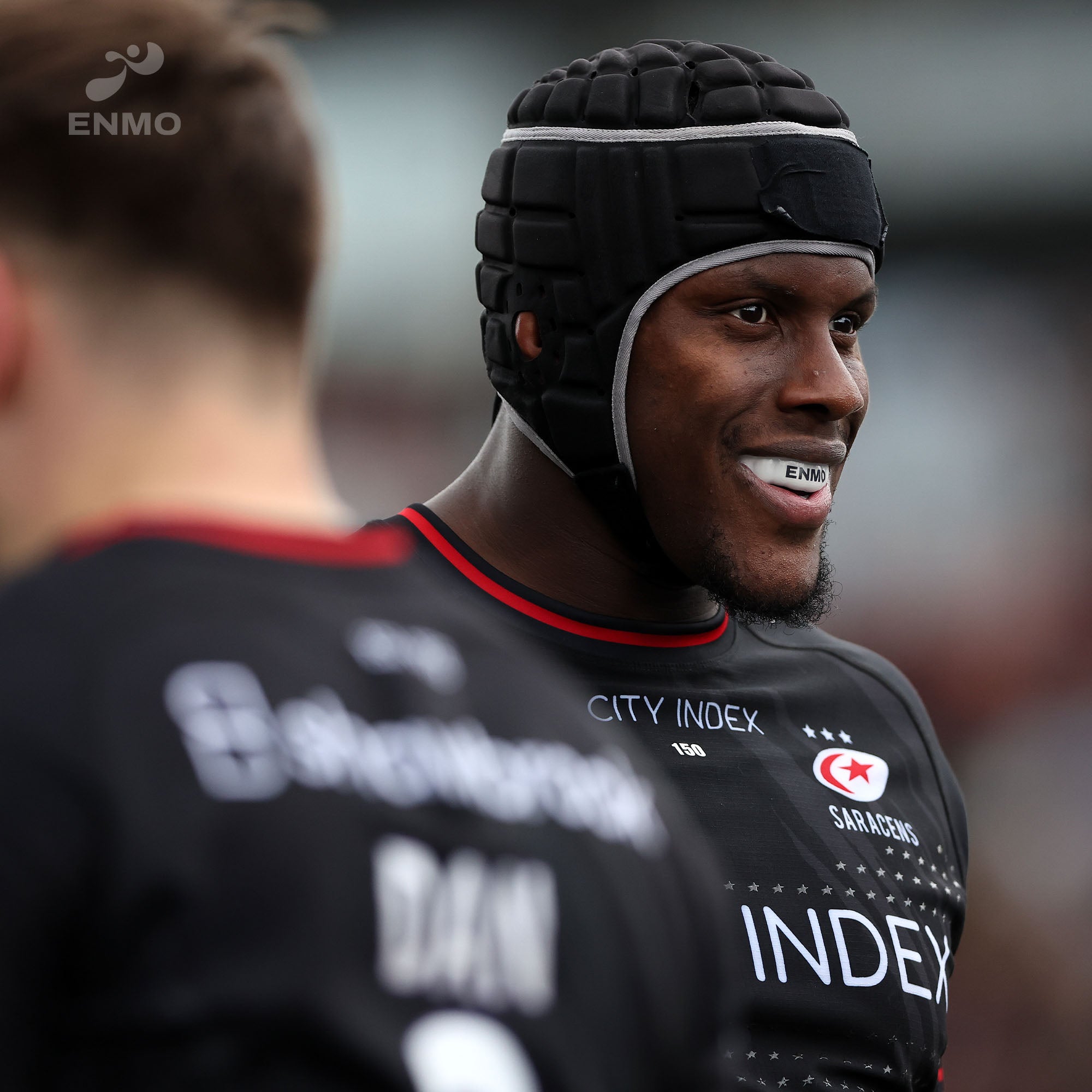 Saracens player wearing Enmo mouthguard and head protection to play rugby.